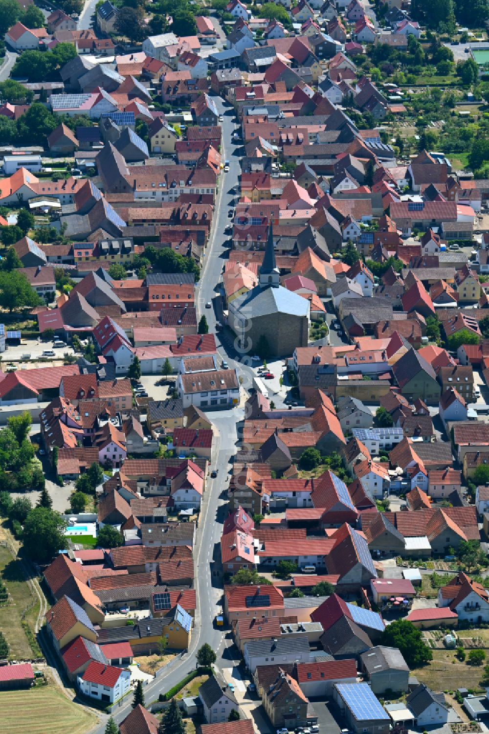 Bergtheim from the bird's eye view: Church building in the village of on place Am Marktplatz in Bergtheim in the state Bavaria, Germany