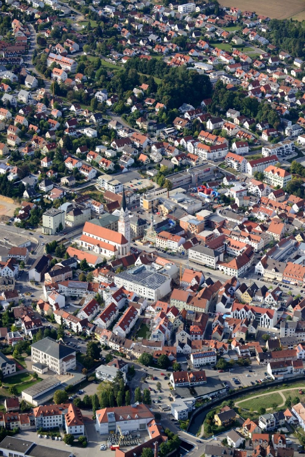 Pfaffenhofen from the bird's eye view: Church building of Stadtpfarrkirche St. Johannes Baptist and view of the historic town- center of Pfaffenhofen in the state of Bavaria