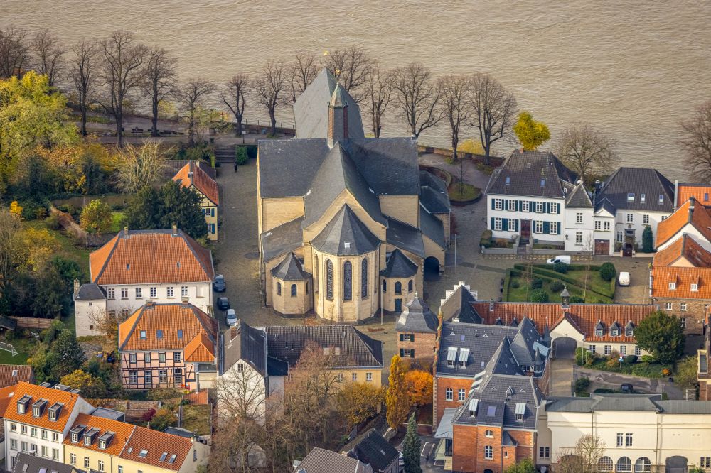Kaiserswerth from the bird's eye view: Church building St. Suitbertus on Fluss Rhein on place Suitbertus-Stiftsplatz in Kaiserswerth at Ruhrgebiet in the state North Rhine-Westphalia, Germany