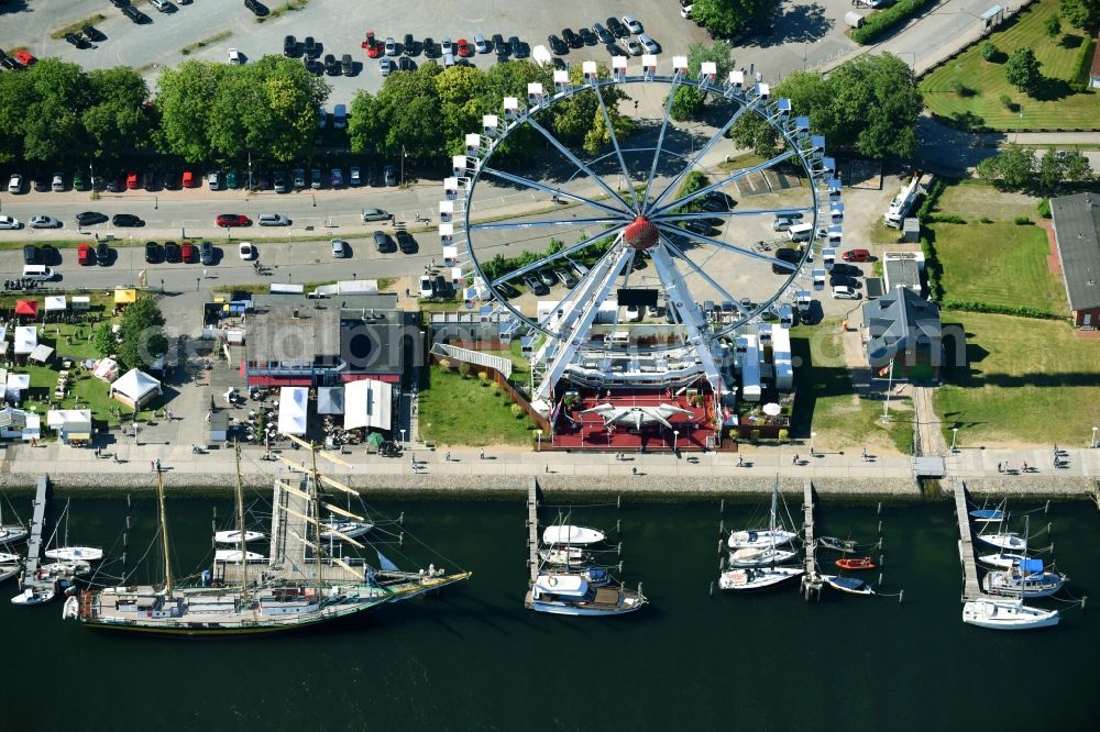 Aerial image Lübeck - Fairgrounds and fairgrounds at the Volksfest at Trelleborgallee in the district of Travemuende in Luebeck in the state of Schleswig - Holstein, Germany. With a view of The Steiger Riesenrad of Steiger OHG