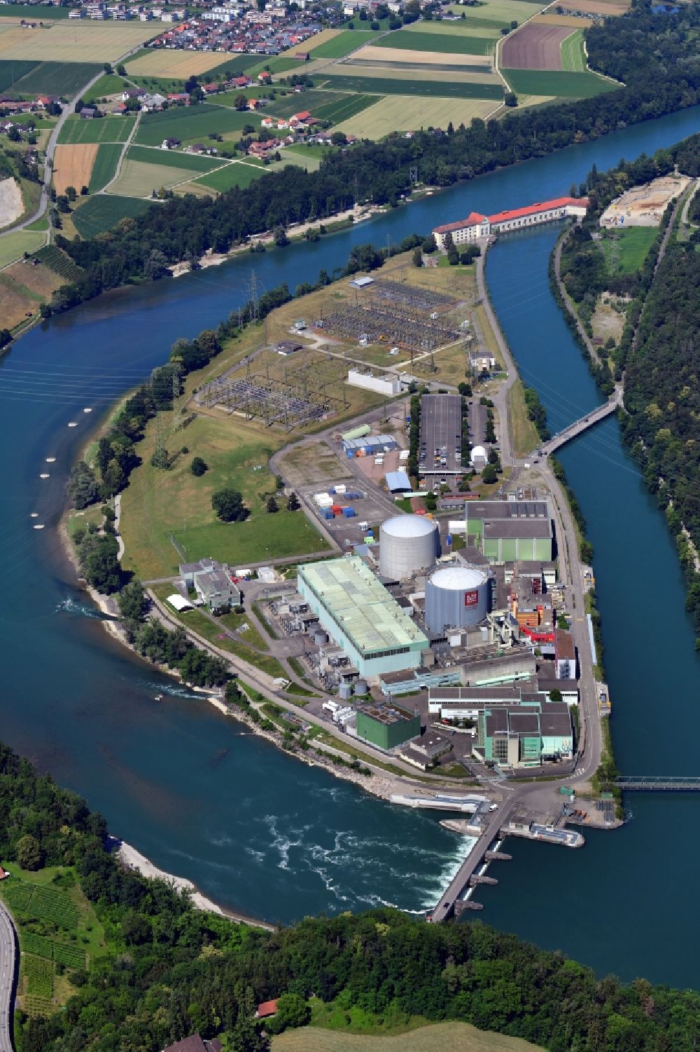 Aerial image Beznau - Building remains of the reactor units and facilities of the NPP nuclear power plant on river of Aare in Beznau in the canton Aargau, Switzerland