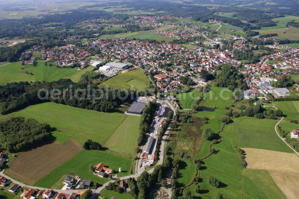 Schöllnach from the bird's eye view: Small company settlement with a branch of the supermarket Rewe on Bahnhofstrasse in the southeast of Schoellnach in the state Bavaria, Germany