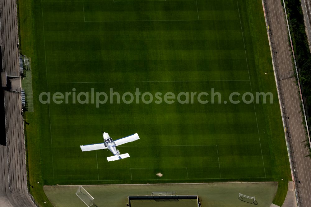 Aerial image Freiburg im Breisgau - Small plane in flight over the Moeslestadion in the airspace in the district Waldsee in Freiburg im Breisgau in the state Baden-Wurttemberg, Germany