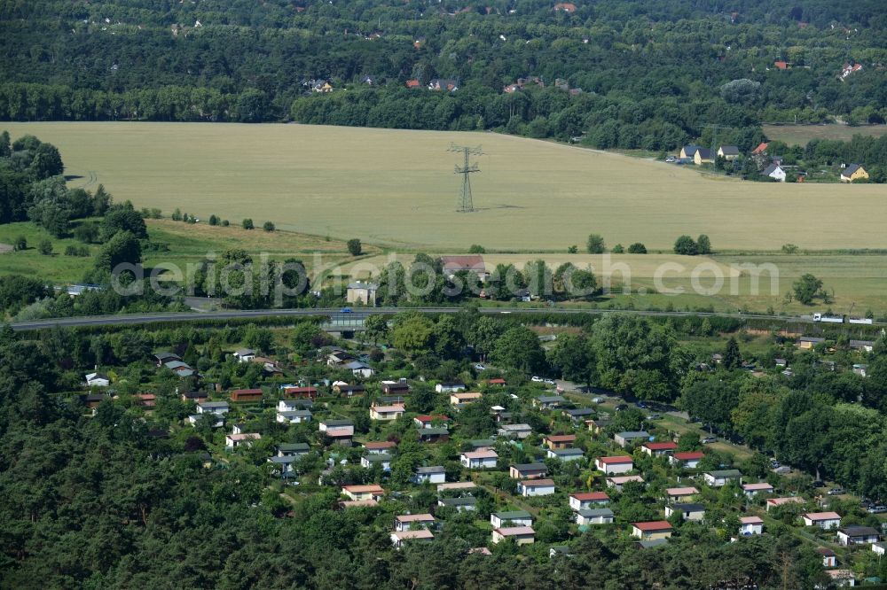 Aerial image Schönefeld - Allotements, high voltage current tower and fields in the Grossziethen part of Schoenefeld in the state of Brandenburg