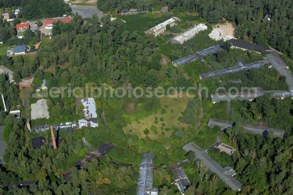 Bad Düben from above - Hospital grounds of the old Waldkrankenhaus in Bad Dueben in the state of Saxony. The historic semi-circular and partly decayed compound with its elongated buildings is located in a forest in the North of the town and used to be known as a specialised orthopaedics clinic in the GDR