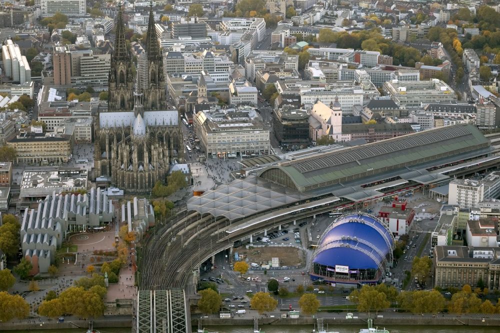 Köln from the bird's eye view: View of the Cologne Cathedral in the center of Cologne, near central station. The Cologne Cathedral is a Roman Catholic church in the Gothic style in Cologne and the Cathedral of the Archdiocese of Cologne. It is the second highest church building in Europe and the third highest in the world