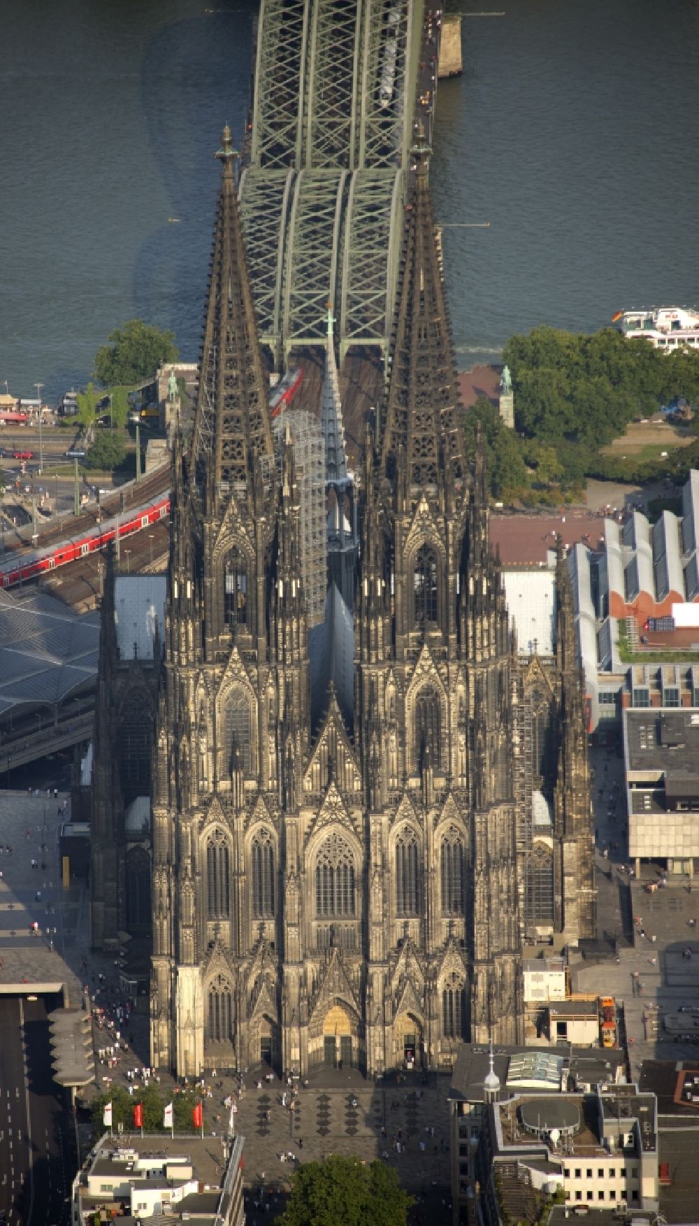 Köln from above - View of the Cologne Cathedral in the center of Cologne, near central station. The Cologne Cathedral is a Roman Catholic church in the Gothic style in Cologne and the Cathedral of the Archdiocese of Cologne. It is the second highest church building in Europe and the third highest in the world
