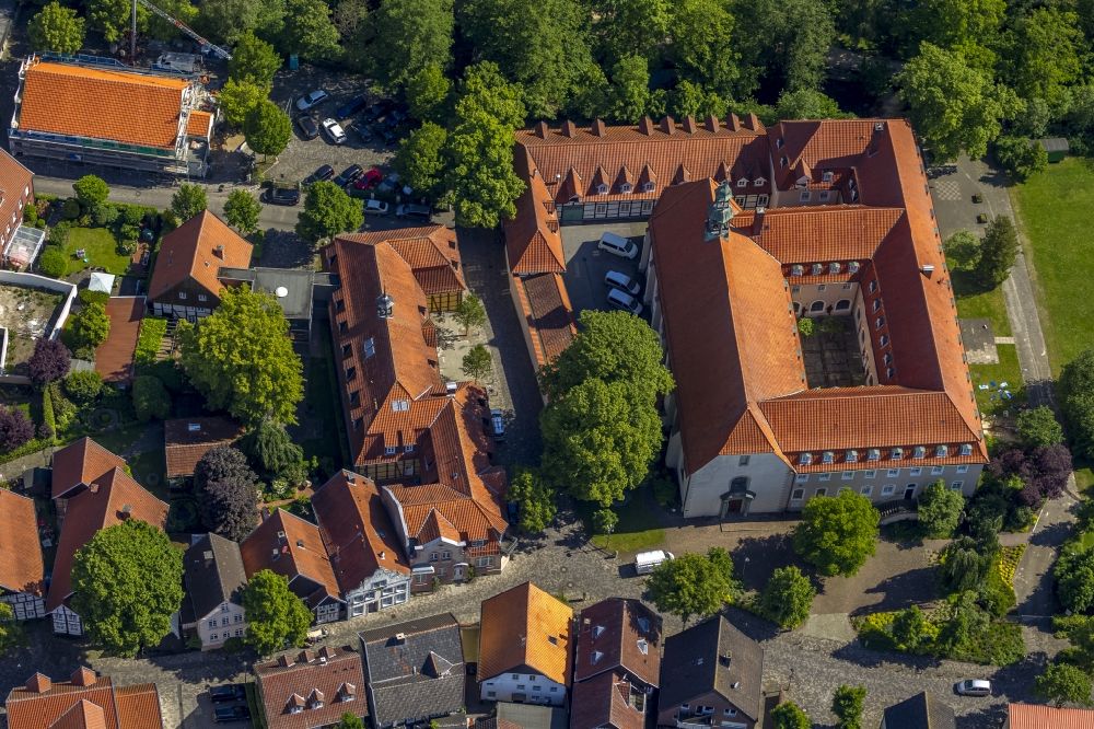 Rietberg from the bird's eye view: The former Franciscan monastery on the Ems in Rietberg in the Klosterstrasse in the state North Rhine-Westphalia. On the left, the building of the old Progymnasium is located on the Emsstrasse. It's a half-timbered house