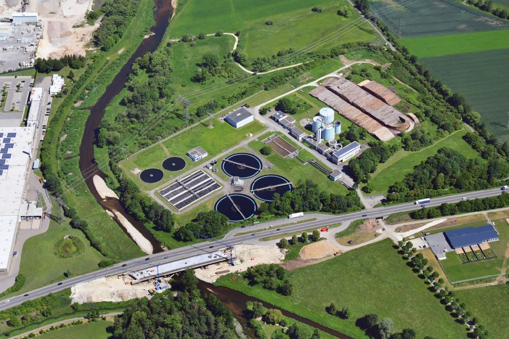 Donaueschingen from the bird's eye view: Sewage works basin and purification steps for waste water treatment in Donaueschingen in the state Baden-Wuerttemberg, Germany together with a timber yard of spruce trunks