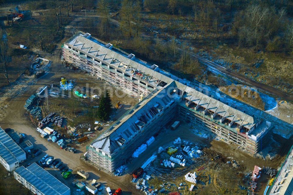 Bernau from the bird's eye view: Construction site for the renovation and reconstruction of the building complex of the former military barracks Sanierungsgebiet Panke-Park on Schoenfelder Weg in Bernau in the state Brandenburg, Germany