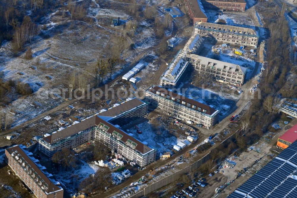 Bernau from the bird's eye view: Construction site for the renovation and reconstruction of the building complex of the former military barracks Sanierungsgebiet Panke-Park on Schoenfelder Weg in Bernau in the state Brandenburg, Germany