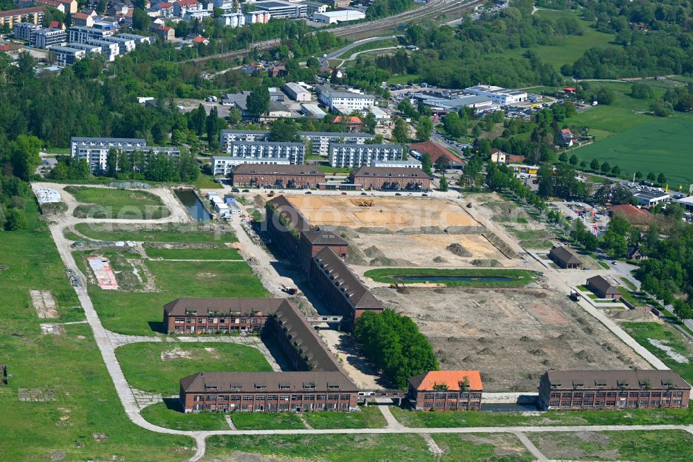 Bernau from the bird's eye view: Construction site for the renovation and reconstruction of the building complex of the former military barracks on Schwanbecker Chaussee in the district Lindow in Bernau in the state Brandenburg, Germany