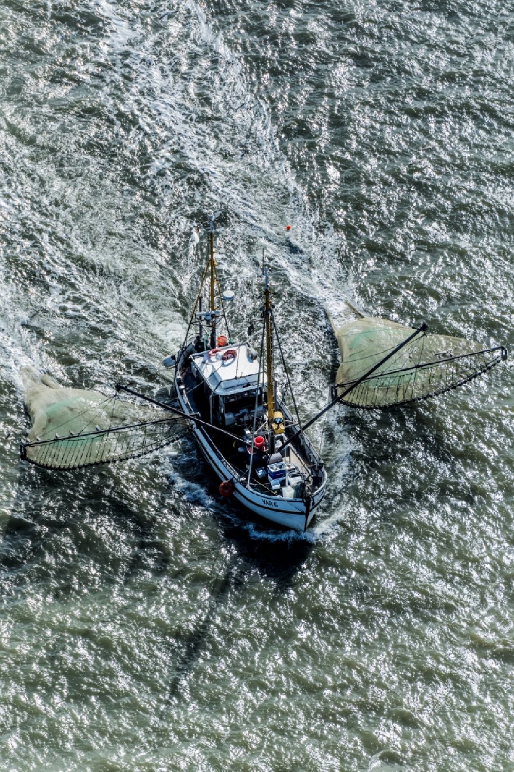 Büsum from the bird's eye view: Shrimp boat on the way of North Sea in Buesum in the state Schleswig-Holstein