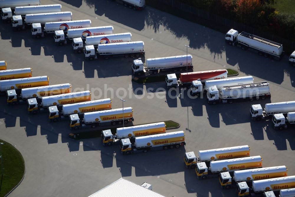 Aerial photograph Seefeld - Automotive parking- space with rows of parked truck tankers in Seefeld in Brandenburg