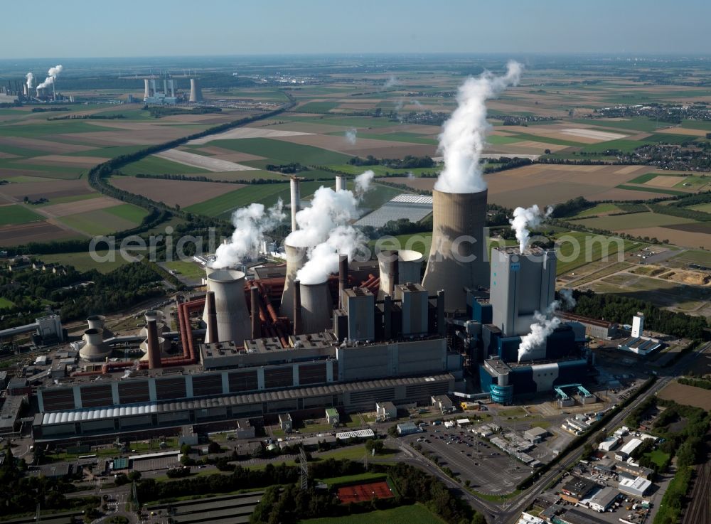 Aerial photograph Bergheim - Niederaussem Power Station. The lignite-fired power plant belongs to the RWE Power company. It consists of nine blocks and is home to the second largest cooling tower in the world. Neurath Power Station can be seen in the background