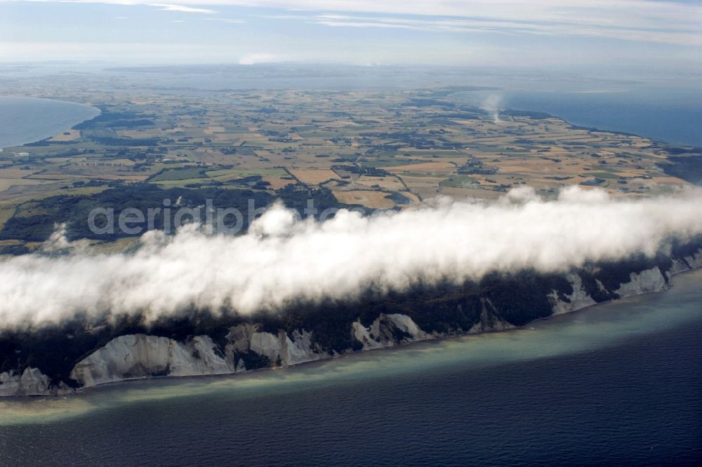 Borre from the bird's eye view: Chalk cliffs of Møns Klint in Borre on the island Moen in Denmark. The clouds over the forest are considered rare natural spectacle that so occurs only in the boundary between land and water