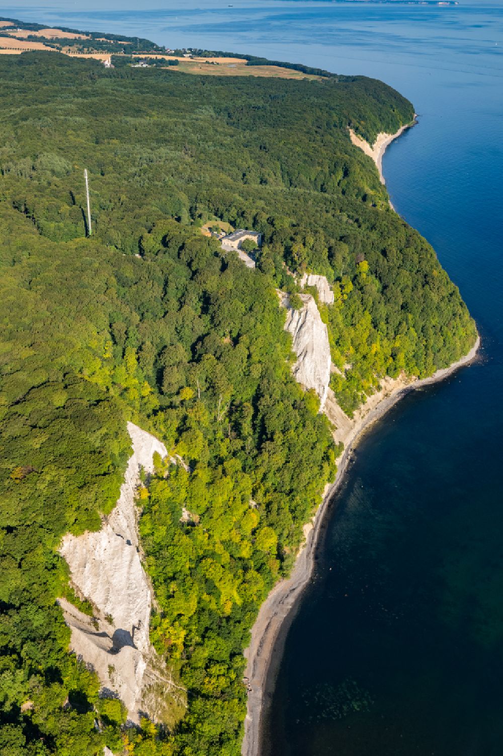 Stubbenkammer from above - Wooded chalk cliffs and cliff landscape in the Jasmund National Park on the cliffs on the Baltic Sea in Stubbenkammer on the island of Ruegen in the state Mecklenburg-West Pomerania, Germany