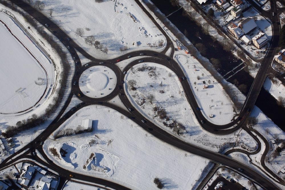Steinen from above - Traffic management of the roundabout of the road B317 in the district Hoellstein in Steinen in the state Baden-Wuerttemberg. Snowy landscape in wintertime