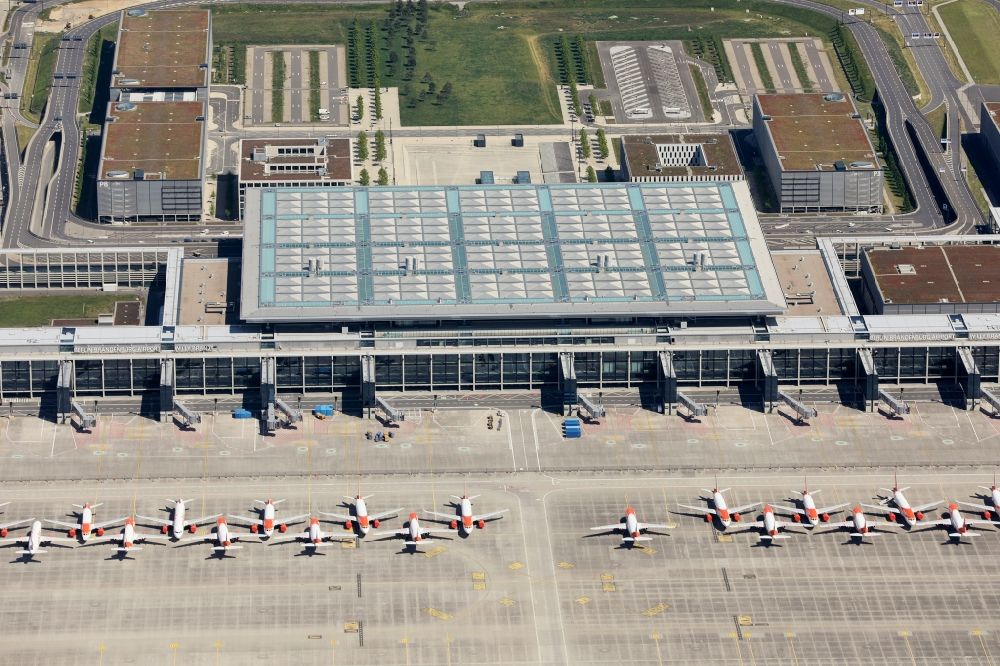 Schönefeld from above - Decommissioned due to crisis passenger airplanes of the airline easyJet in parking position - parking area at the airport in Schoenefeld in the state Brandenburg, Germany