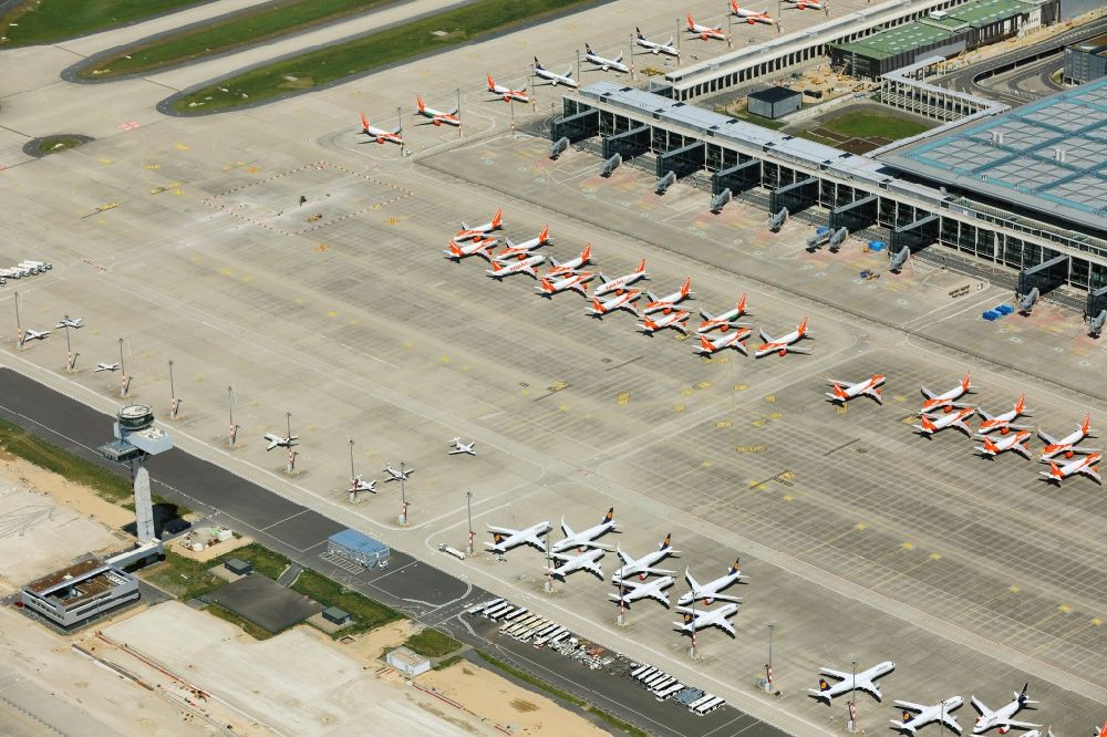 Aerial image Schönefeld - Decommissioned due to crisis passenger airplanes of the airline easyJet in parking position - parking area at the airport in Schoenefeld in the state Brandenburg, Germany