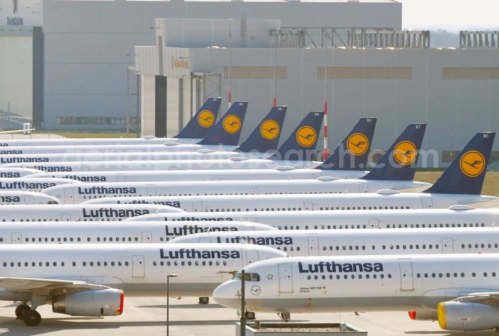 Aerial photograph Selchow - Decommissioned due to crisis passenger airplanes of the airline Lufthansa in parking position - parking area at the BER - airport in Schoenefeld in the state Brandenburg, Germany