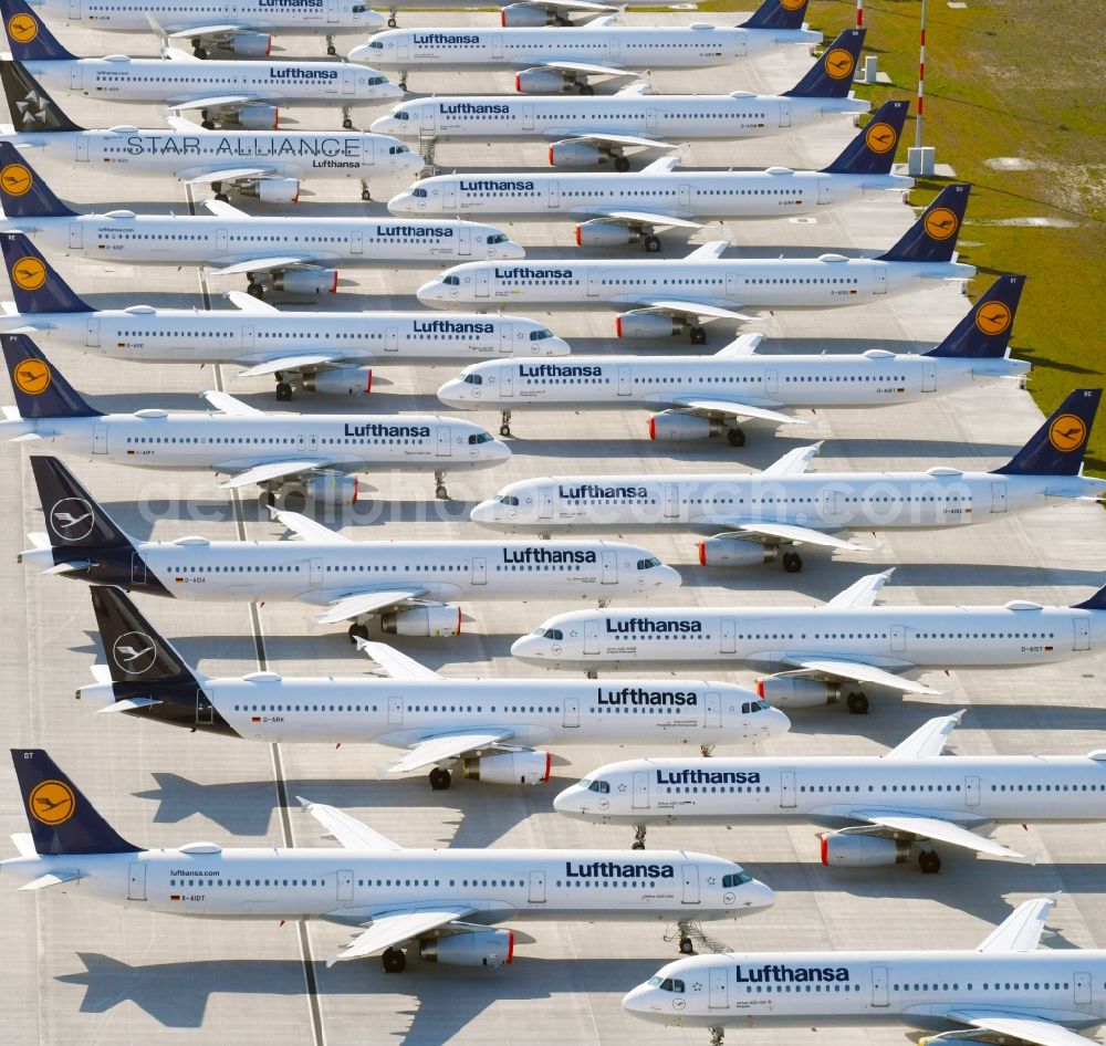 Schönefeld from above - Decommissioned due to crisis passenger airplanes of the airline Lufthansa in parking position - parking area at the airport in Schoenefeld in the state Brandenburg, Germany