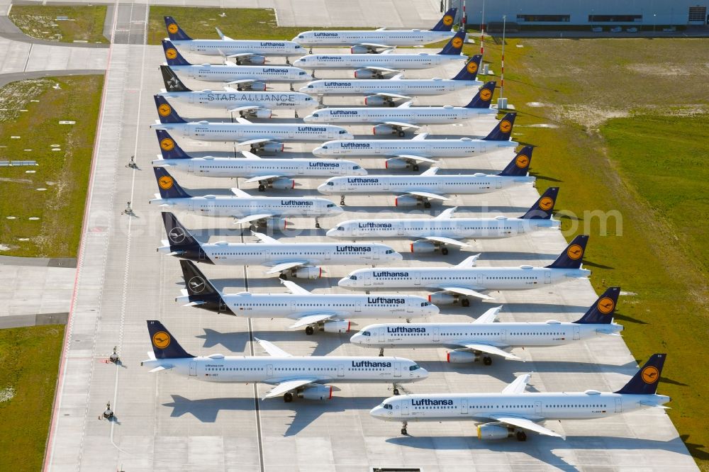 Schönefeld from the bird's eye view: Decommissioned due to crisis passenger airplanes of the airline Lufthansa in parking position - parking area at the airport in Schoenefeld in the state Brandenburg, Germany