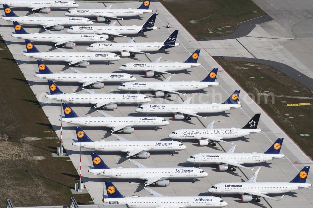 Aerial image Schönefeld - Decommissioned due to crisis passenger airplanes of the airline Lufthansa in parking position - parking area at the airport in Schoenefeld in the state Brandenburg, Germany