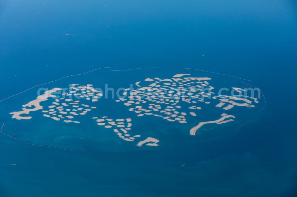 Dubai from above - Aerial view of the Dubai coast, The World Islands from the bird's eye view in Dubai in United Arab Emirates