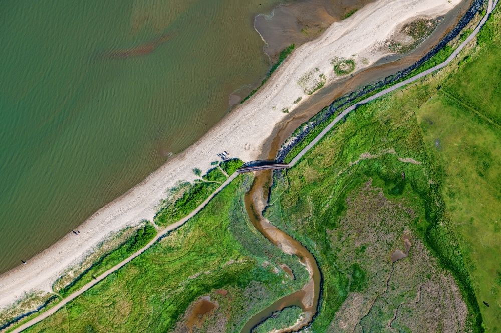Sylt from above - Coastal landscape with dike protection strips with the bridge of lies in Munkmarsch (Sylt) in the state Schleswig-Holstein, Germany