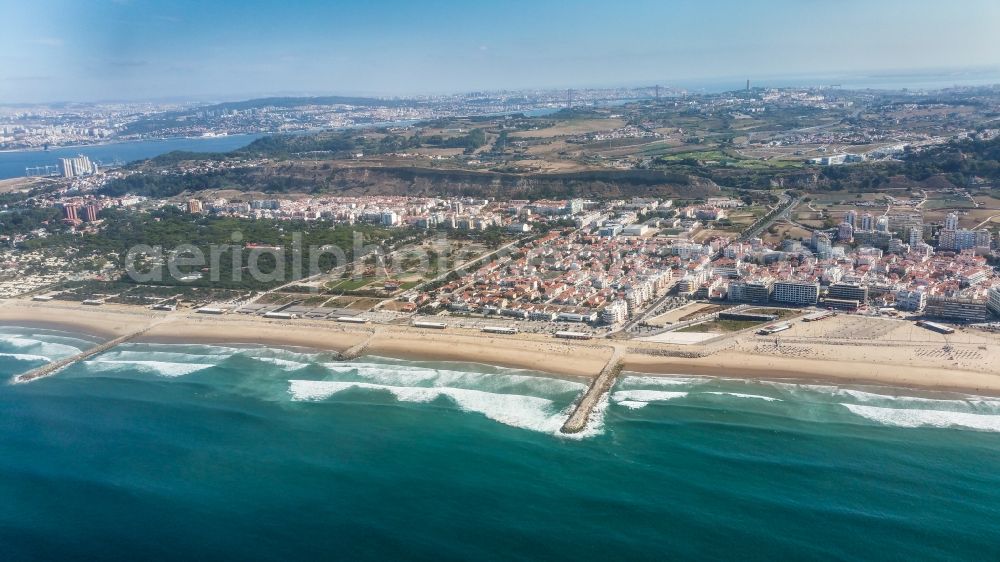 Costa da Caparica from above - Coastline on the sandy beach of Costa da Caparica in Setubal, Portugal