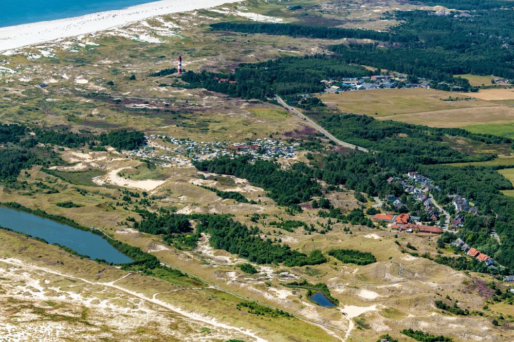 Aerial photograph Wittdün auf Amrum - Coastline with lighthouse and camp site on the sandy beach of Nordsee- Insel Amrum in Nebel in the state Schleswig-Holstein