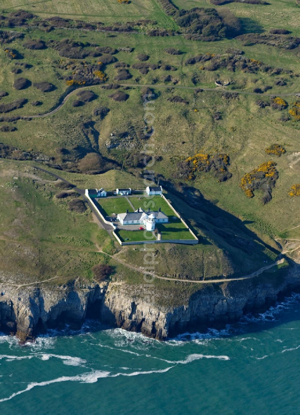 Aerial photograph Anvil Point Lighthouse - Coastline on Durlston Country Park and National Nature Reserve on Lighthouse Rd at the rocky cliffs of of English Channel Anvil Point Lighthouse in Swanage in England, United Kingdom