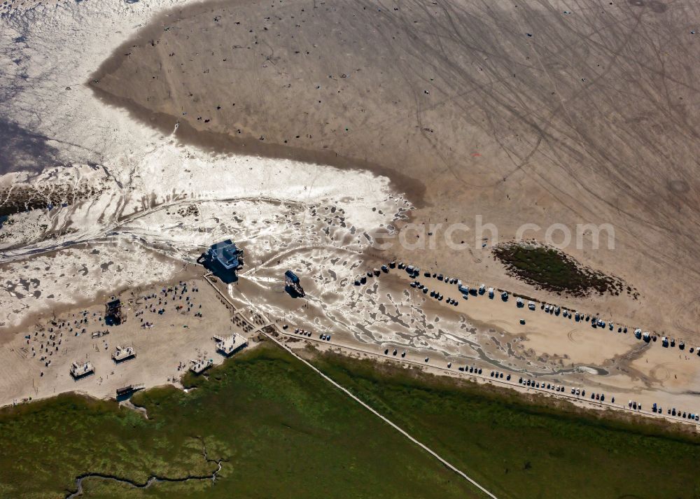 Sankt Peter-Ording from above - Coastal landscape and beach parking lot at spring tide on the sandy beach in the district Boehl in Sankt Peter-Ording in the state Schleswig-Holstein, Germany. Spring tide floods parts of Boehler Strandparkplatz at the salt marshes