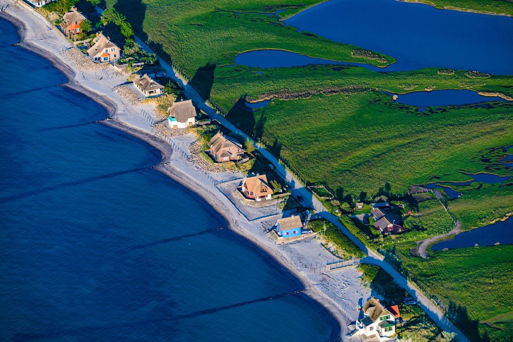 Heiligenhafen from above - Coastal area of the peninsula Graswarder-Heilgenhafen with a few single- family houses at the beach in Grossenbrode in the state Schleswig-Holstein