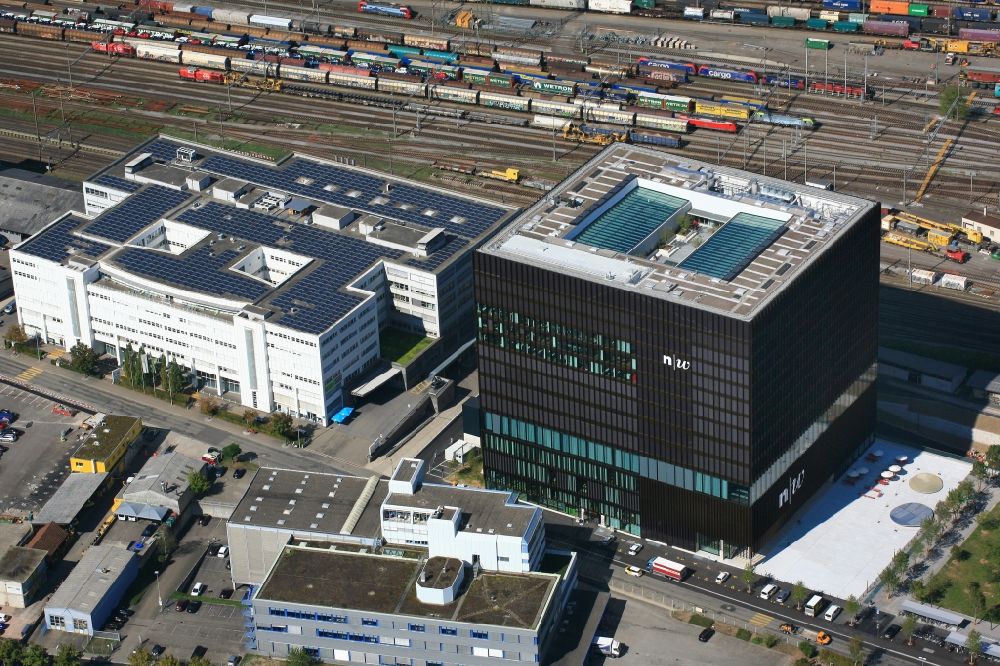 Aerial image Muttenz - New building of the campus of the University of Applied Sciences Nordwestschweiz FHNW in the Polyfield in Muttenz in the canton Basel-Landschaft, Switzerland. Students for architecture, life sciences, educational science, degree in education, sozial work and mechatronics