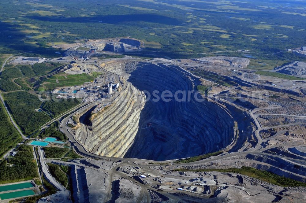 Gällivar from above - Terrain and overburden surfaces of the copper mine open pit in Gaellivar in Sweden