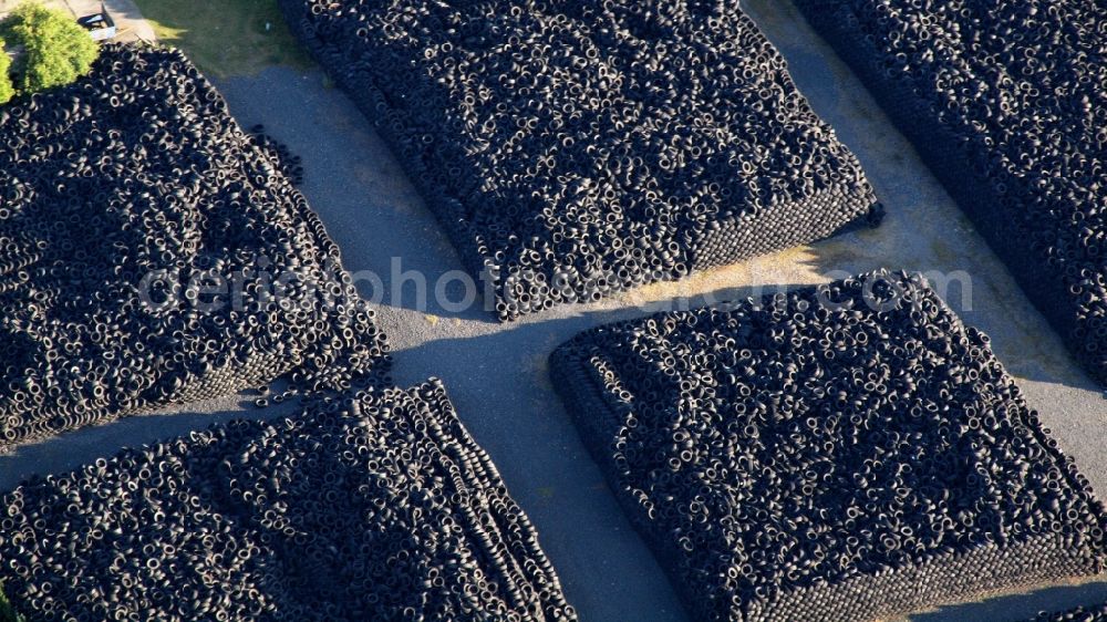 Osterwieck from above - Bearing surface for used tires in the industrial area in Osterwieck in the state Saxony-Anhalt, Germany