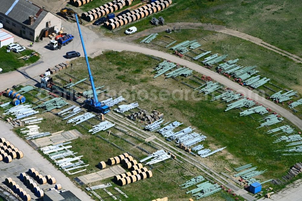 Blumberg from the bird's eye view: Storage area for electricity pylons - steel girders to replace regional electricity pylons in the industrial park in Blumberg in the state Brandenburg, Germany