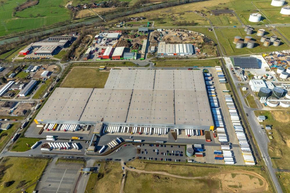 Aerial photograph Hünxe - Warehouses and forwarding building LGI Logistics Group International GmbH on Werner-Heisenberg-Strasse in Huenxe in the state North Rhine-Westphalia, Germany