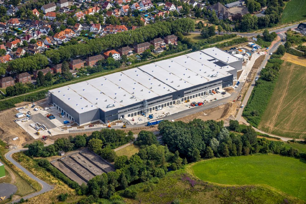 Kamp-Lintfort from the bird's eye view: Construction site for a warehouse and forwarding building Alpha Industrial on street Vinnmannsweg in Kamp-Lintfort at Ruhrgebiet in the state North Rhine-Westphalia, Germany