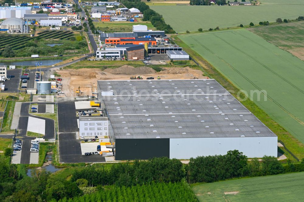 Aerial photograph Oberkrämer - Construction site for a warehouse and forwarding building of VAH Jager Verlagsauslieferung and Fulfillment-Service GmbH on street Im Gewerbepark in Oberkraemer in the state Brandenburg, Germany