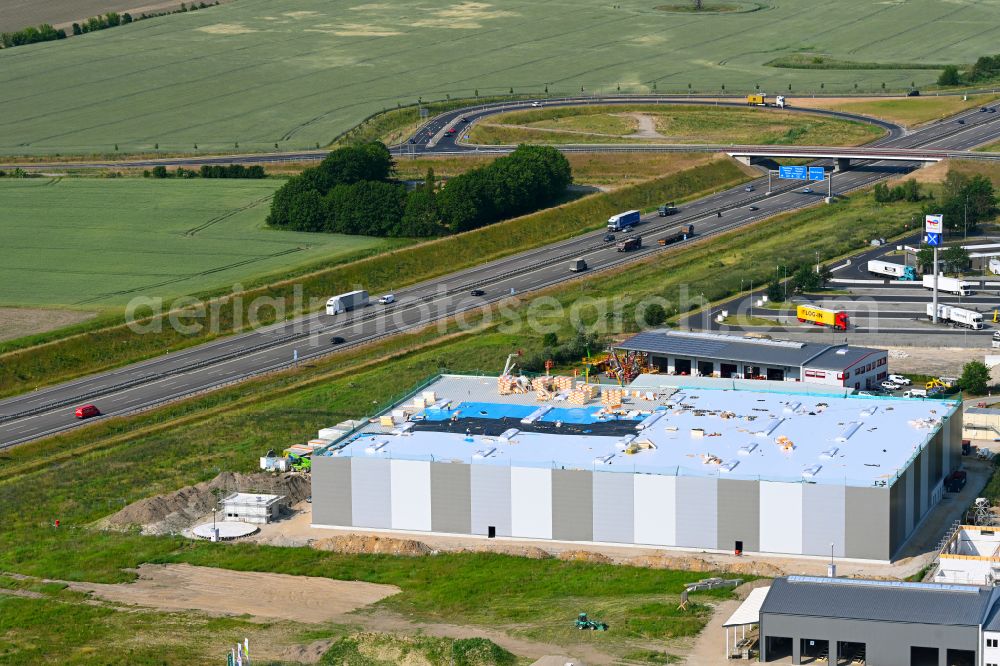 Vehlefanz from the bird's eye view: Construction site for a warehouse and forwarding building in Vehlefanz in the state Brandenburg, Germany
