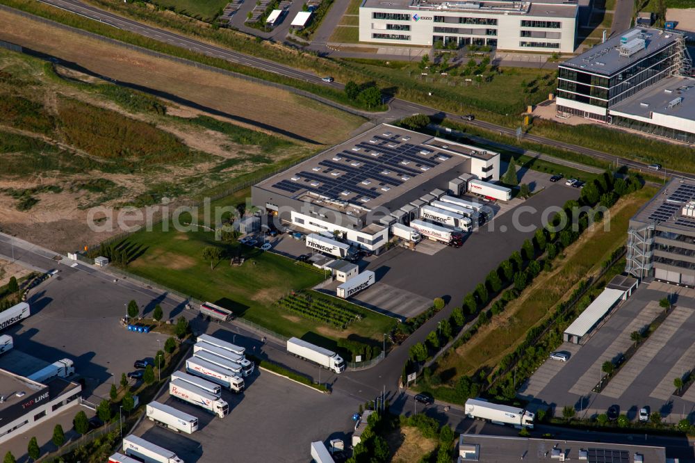 Rülzheim from the bird's eye view: Warehouse complex-building in the industrial area TRANSAC Intern. Speditionsgesellschaft mbH in Ruelzheim in the state Rhineland-Palatinate