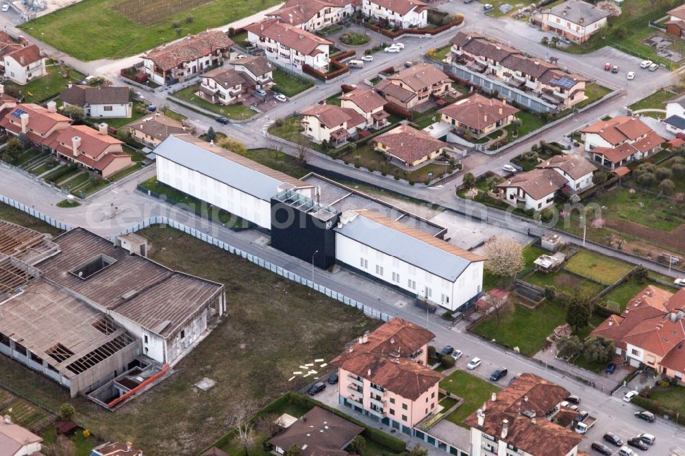 Aerial image San Daniele del Friuli - Warehouse complex-building in the industrial area of Prosciuttificio Friulano und Leoncini Prosciutti in San Daniele del Friuli in Friuli-Venezia Giulia, Italy