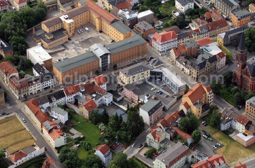 Apolda from the bird's eye view: The District Office of the County of Weimar is located in a building complex on the corner Dornburger street - Bahnhofstrasse in Apolda in state of Thuringia. At the right edge of the picture, the Luther Church is seen at Melanchtonplatz