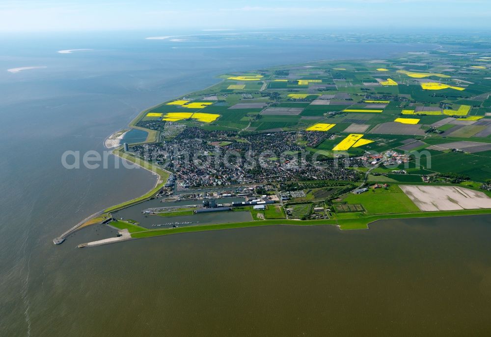 Aerial image Büsum - Landscape and coast around Buesum in the state of Schleswig-Holstein. Buesum is located in the Meldorfer Bay on the North Sea. The harbour is located on the ocean current Piep and is protected by a dam. The area is characterised by the landscape of the district of Dithmarschen, an agricultural region with many fields along the coastline