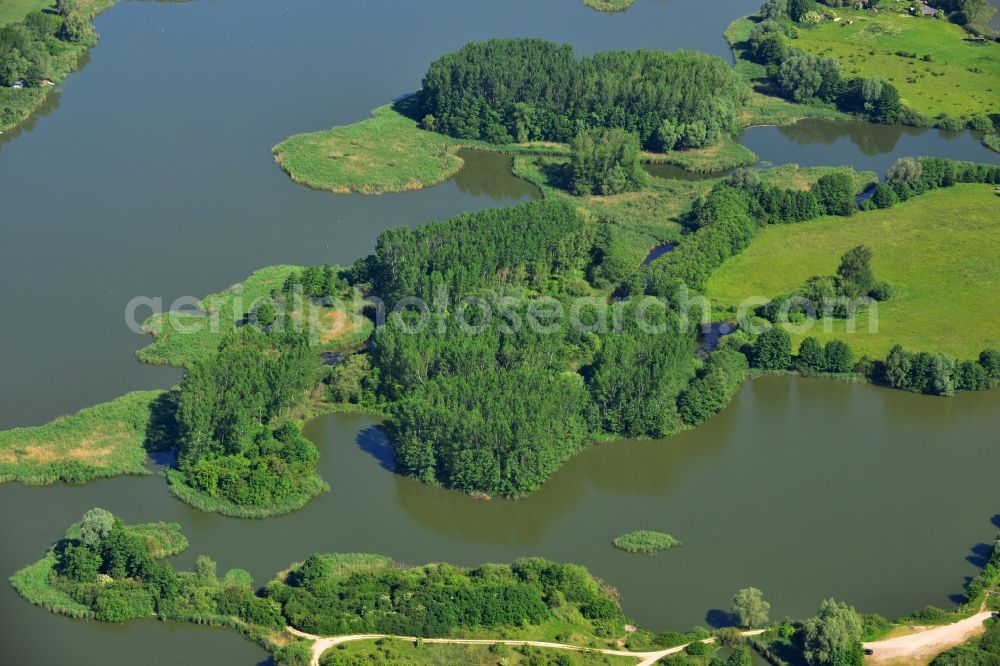 Oberkrämer from the bird's eye view: View of the Mühlen lake in the local district Vehlefanz of the municipality Oberkrämer in Brandenburg. The lake was created by the LPG to be used as a water reservoir to irrigate the surrounding fields. To this day, the lake is still used for that