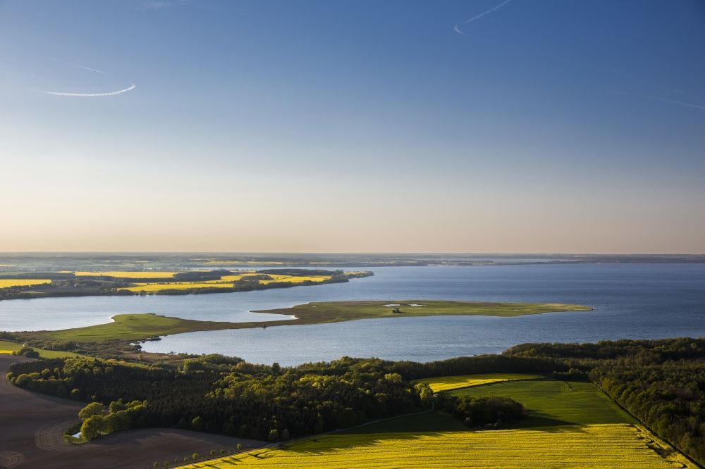 Ludorf from above - A landscape with yellow flowering fields on Lake Mueritz in Ludorf in Mecklenburg - Western Pomerania