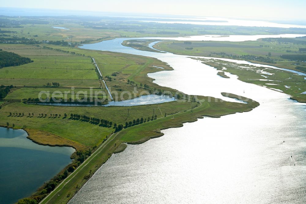 Kröslin from the bird's eye view: Landscape on the banks of the Peenestrom river and the Peenewiesen with a view of the Gross Wotig pond landscape in Kroeslin in the state of Mecklenburg-Western Pomerania